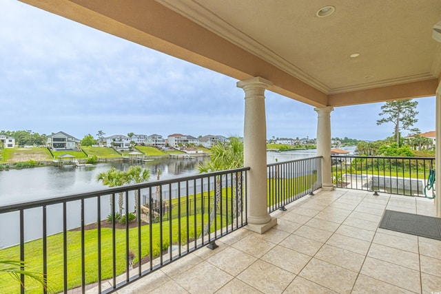 balcony featuring a water view and a residential view