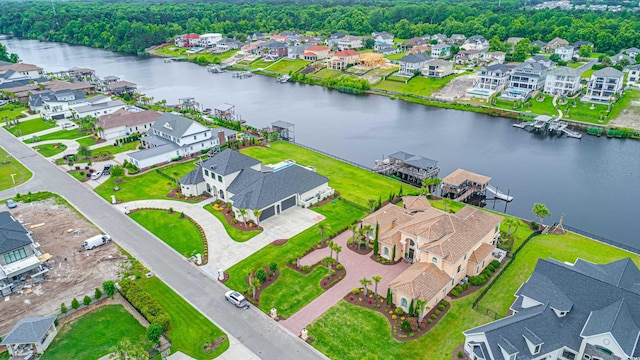 birds eye view of property featuring a residential view and a water view