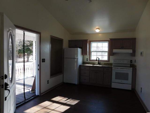 kitchen featuring vaulted ceiling, sink, dark wood-type flooring, and white appliances