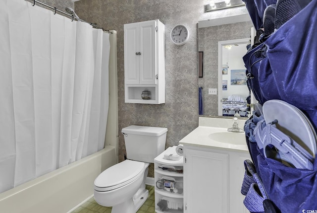 full bath featuring shower / bath combo with shower curtain, wallpapered walls, toilet, and vanity