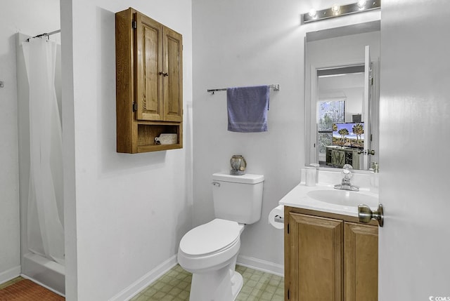 bathroom featuring vanity, a shower with shower curtain, tile patterned floors, and toilet