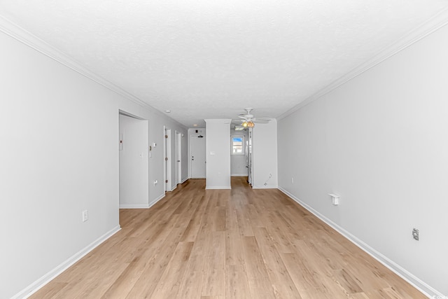 unfurnished living room featuring light wood-style floors, ornamental molding, ceiling fan, a textured ceiling, and baseboards