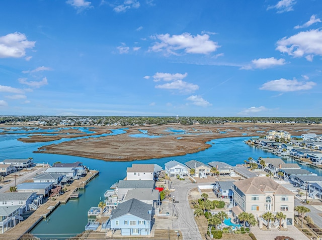 drone / aerial view featuring a water view and a residential view