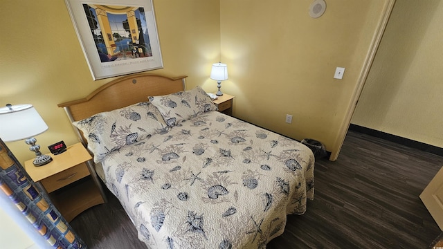 bedroom featuring dark hardwood / wood-style floors