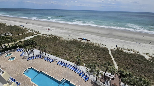 drone / aerial view with a view of the beach and a water view