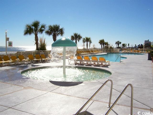 view of pool featuring a patio area and pool water feature