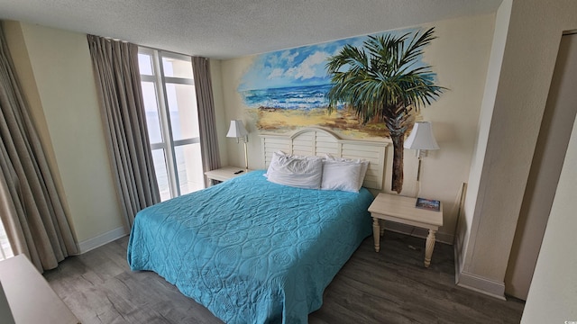 bedroom featuring wood-type flooring and a textured ceiling