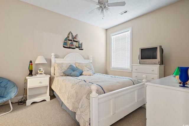 bedroom with ceiling fan and light colored carpet