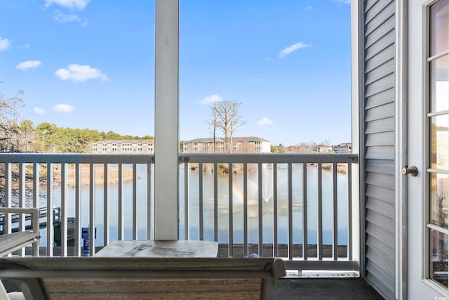 balcony featuring a water view