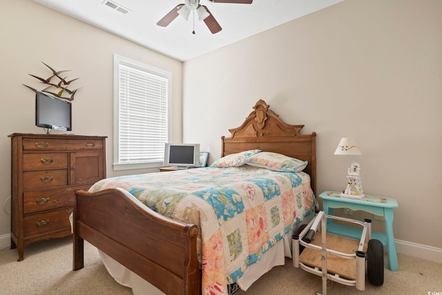 bedroom featuring ceiling fan and light carpet