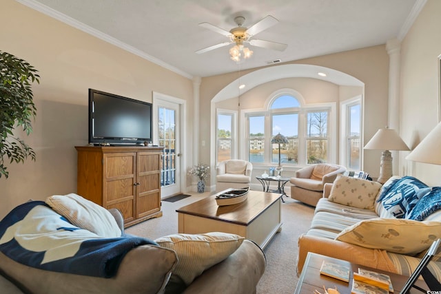 living room featuring ceiling fan, light colored carpet, and ornamental molding