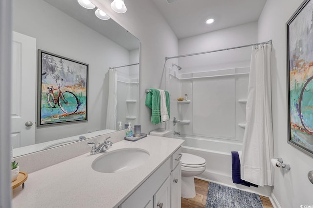 bathroom featuring vanity, shower / bath combination with curtain, toilet, and wood finished floors