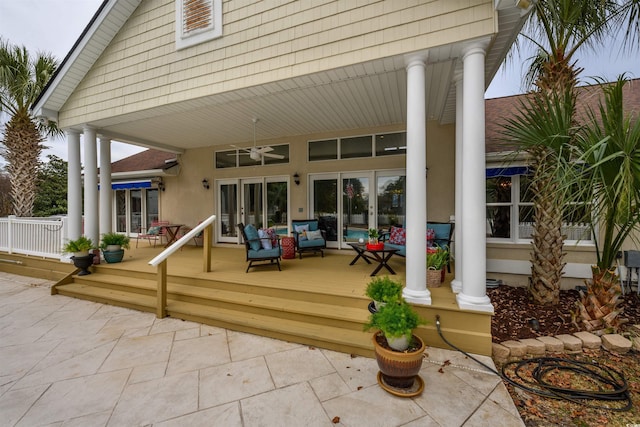 back of house featuring ceiling fan and an outdoor living space