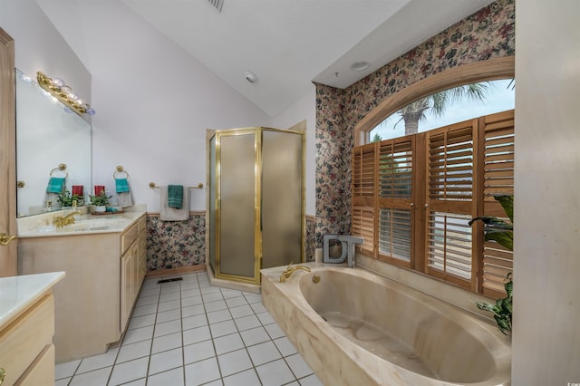 bathroom featuring tile patterned floors, vanity, separate shower and tub, and vaulted ceiling