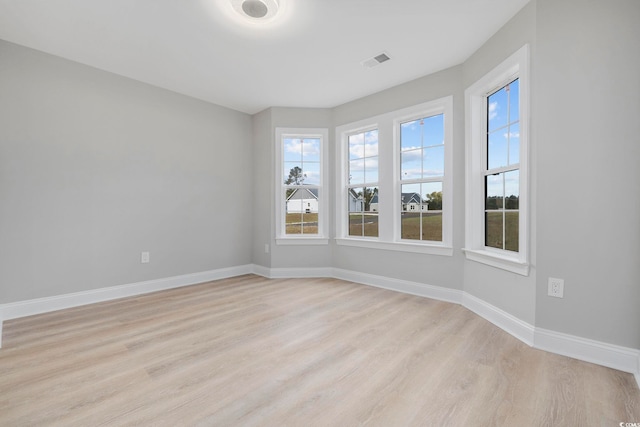 unfurnished room featuring light wood-type flooring