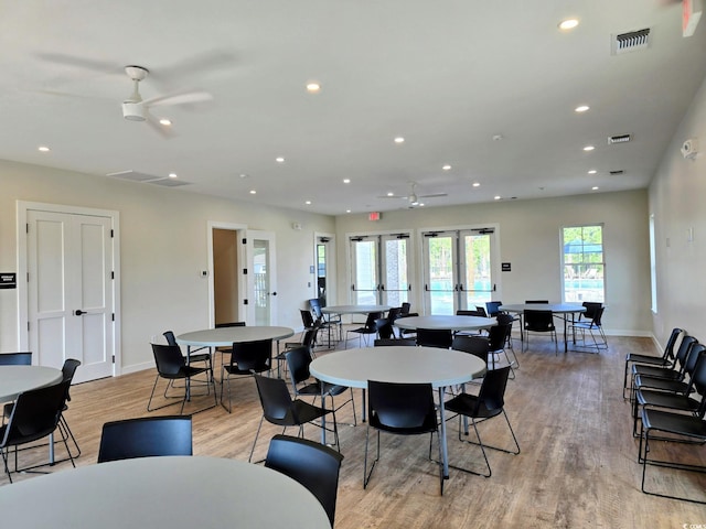 dining room featuring french doors, light hardwood / wood-style floors, and ceiling fan