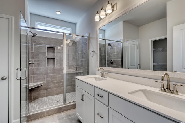 bathroom with vanity, tile patterned floors, and walk in shower