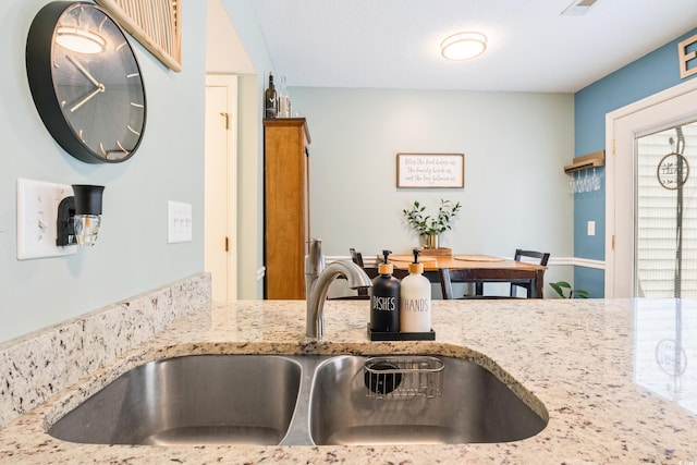6706 Bryant St Unit B, Myrtle Beach, SC 29572 - kitchen featuring a sink and light stone countertops