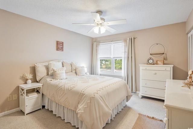 6706 Bryant St Unit B, Myrtle Beach, SC 29572 - bedroom featuring light carpet, ceiling fan, baseboards, and a textured ceiling