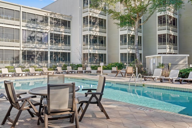 view of swimming pool with a patio