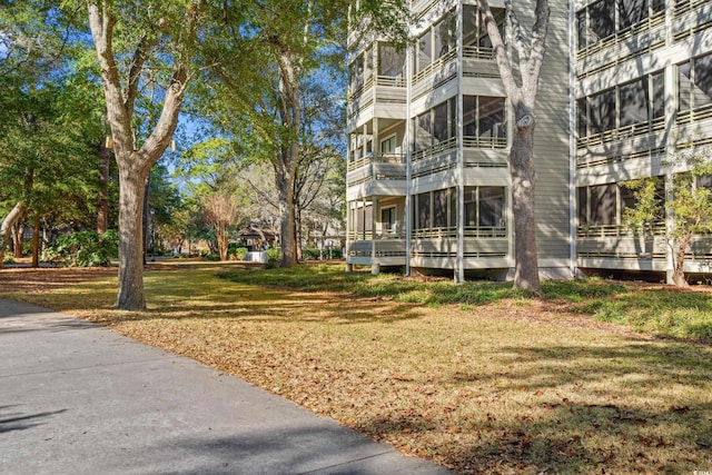 view of home's community featuring a lawn