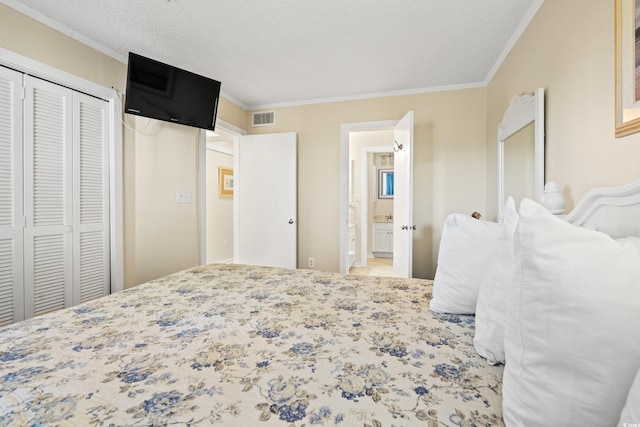 bedroom with a textured ceiling, a closet, and ornamental molding