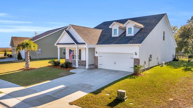 view of front of property featuring a shingled roof, a front yard, concrete driveway, and fence