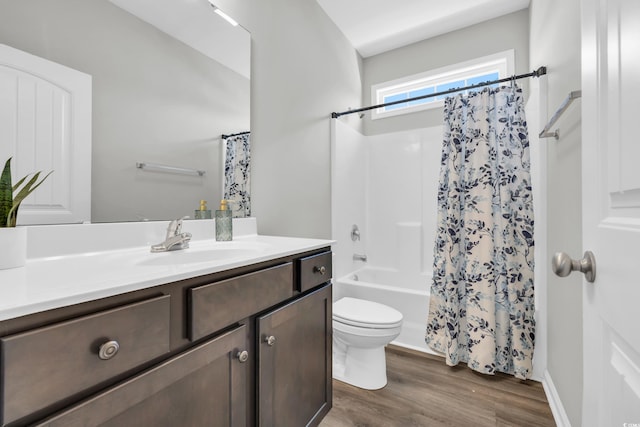 full bathroom featuring shower / bath combination with curtain, vanity, toilet, and wood finished floors