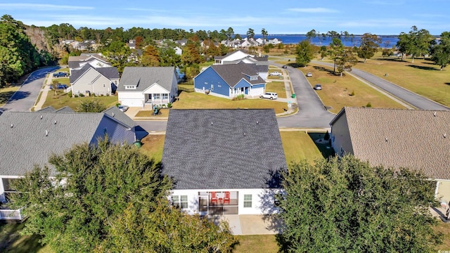 birds eye view of property with a residential view