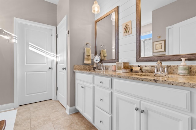 bathroom with vanity and tile patterned floors