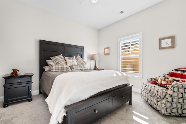 bedroom with light carpet and ceiling fan