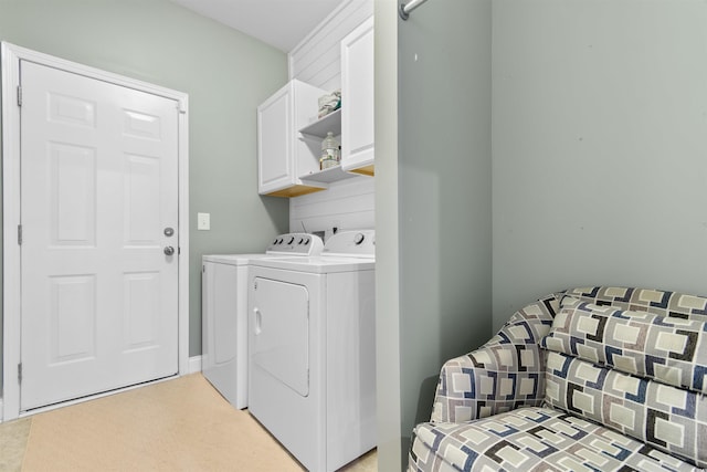 laundry area featuring cabinets and independent washer and dryer