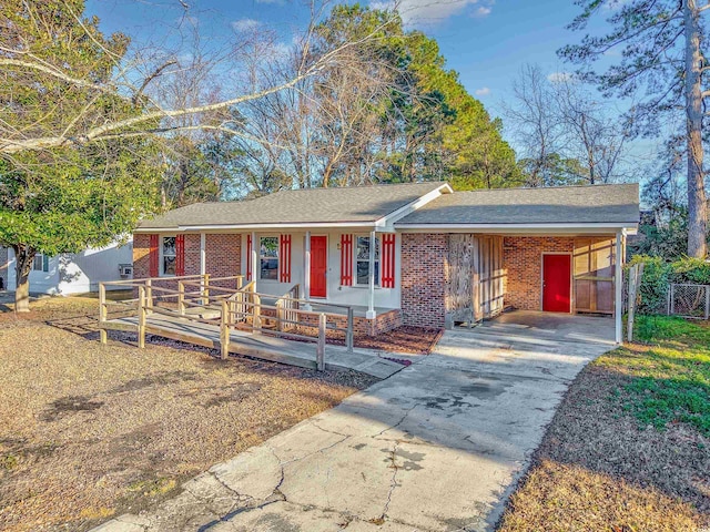 ranch-style house with a carport