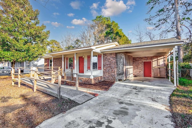 ranch-style home with a carport and a porch