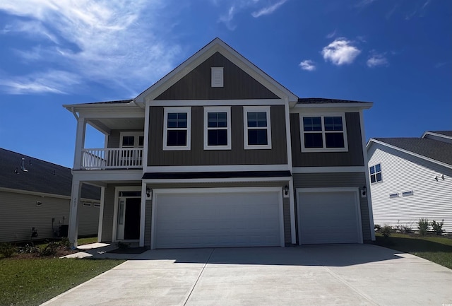 view of front of house featuring a garage and a balcony