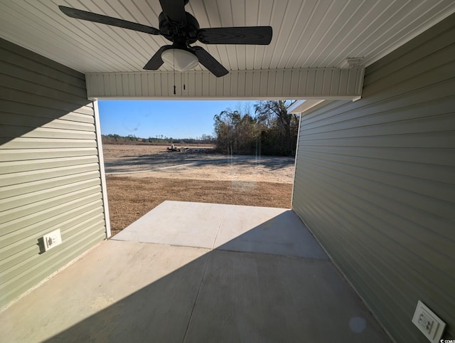 view of patio featuring ceiling fan