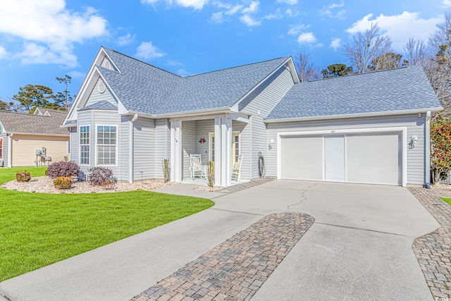 view of front of house with a front lawn and a garage