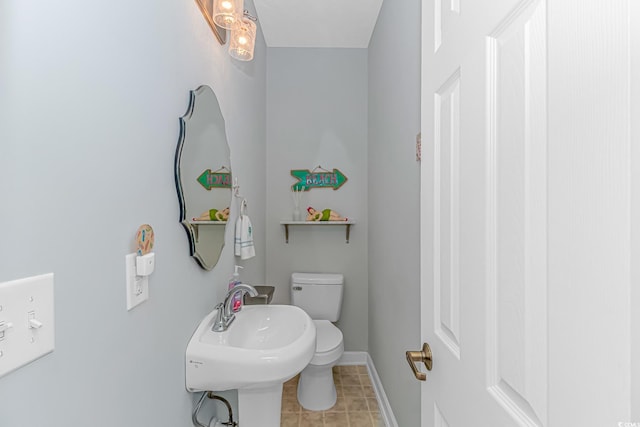 bathroom with toilet and sink