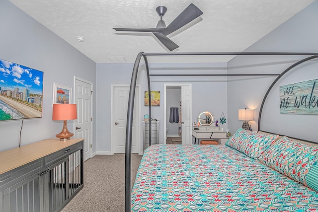 bedroom with light carpet, a textured ceiling, and ceiling fan