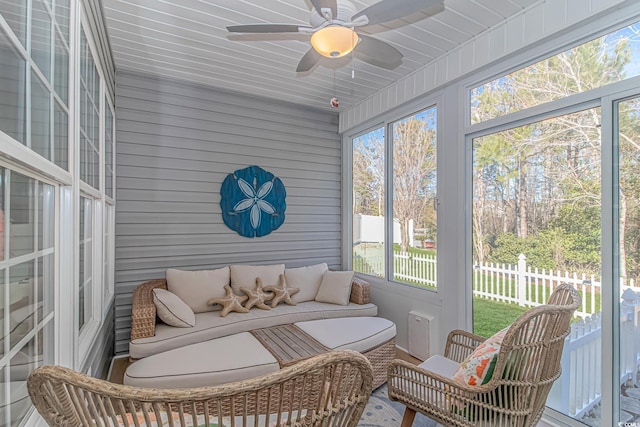 sunroom with ceiling fan