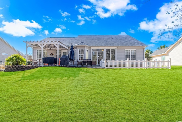 rear view of property featuring a lawn and a pergola