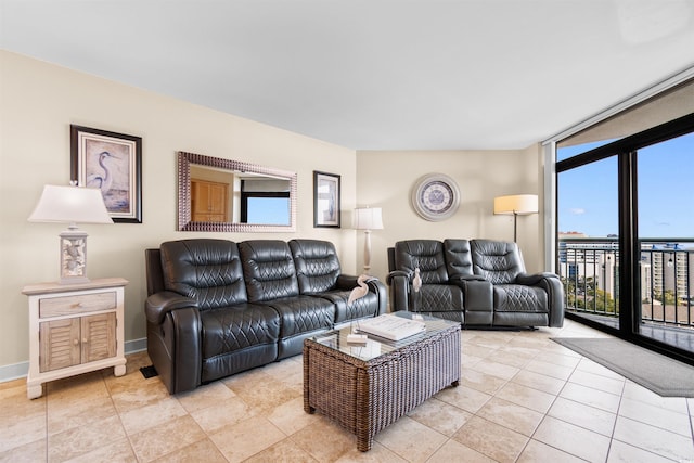 tiled living room featuring expansive windows