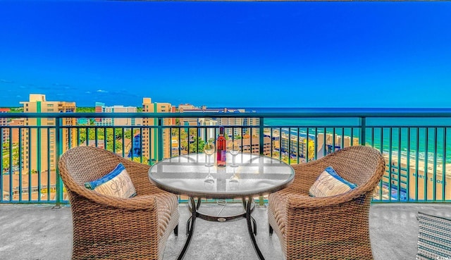 balcony featuring a water view