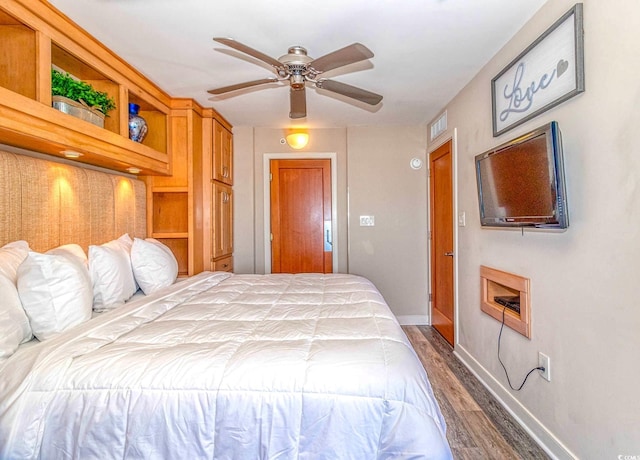 bedroom featuring dark wood-type flooring and ceiling fan