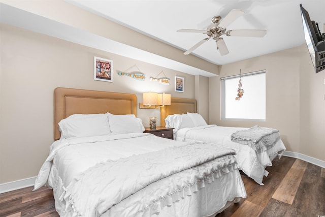 bedroom featuring dark hardwood / wood-style flooring and ceiling fan