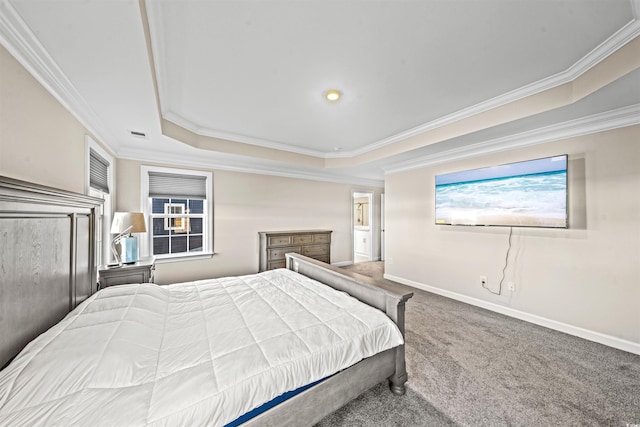 bedroom featuring carpet, a tray ceiling, and ornamental molding