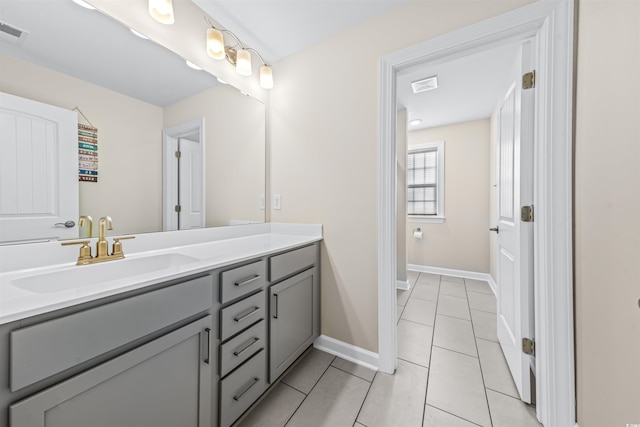 bathroom featuring tile patterned flooring and vanity