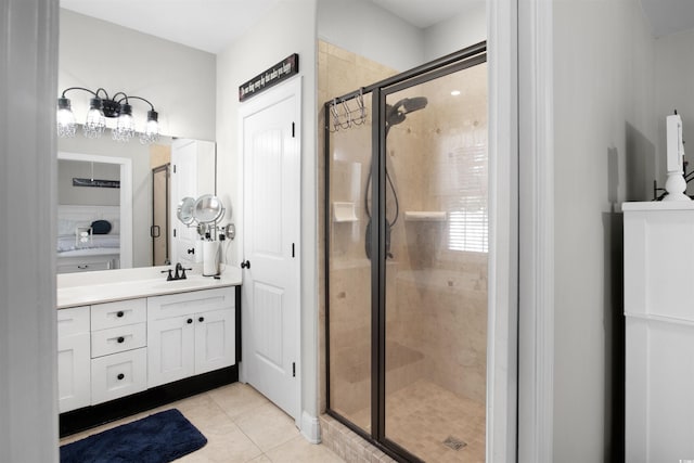 bathroom featuring tile patterned floors, vanity, and an enclosed shower