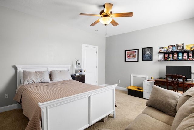 bedroom featuring light colored carpet and ceiling fan