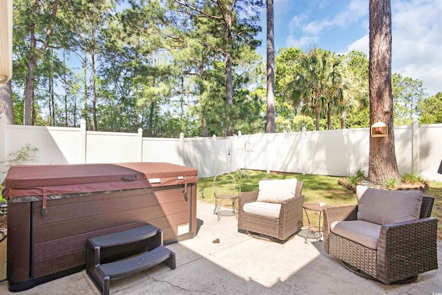 view of patio / terrace featuring a hot tub